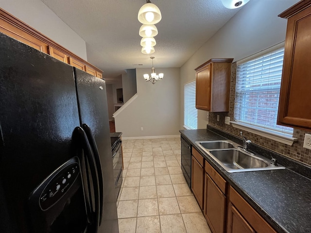 1182 Collierville-Arlington Rd, Collierville, TN 38017 - kitchen with black appliances, dark countertops, a textured ceiling, tasteful backsplash, and decorative light fixtures