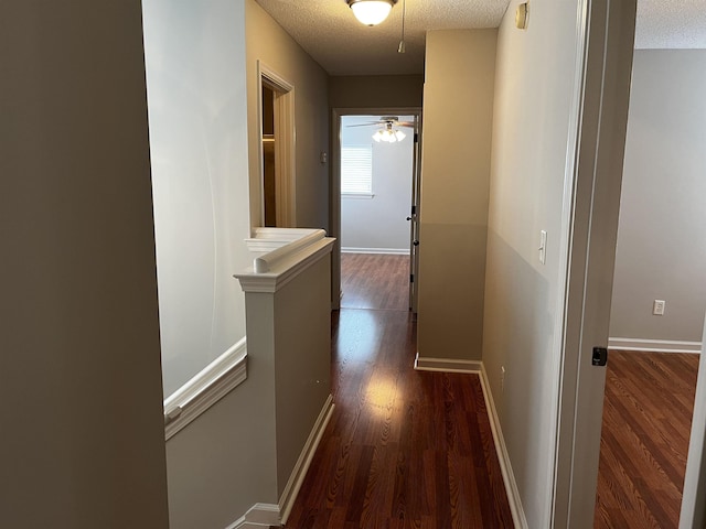 1182 Collierville-Arlington Rd, Collierville, TN 38017 - hallway featuring an upstairs landing, dark wood-style floors, and a textured ceiling