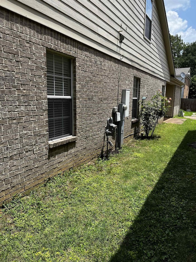 1182 Collierville-Arlington Rd, Collierville, TN 38017 - view of home's exterior featuring a lawn and brick siding