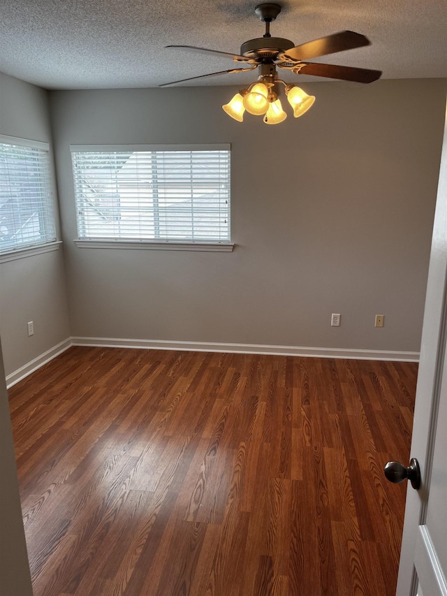 1182 Collierville-Arlington Rd, Collierville, TN 38017 - unfurnished room featuring ceiling fan, a textured ceiling, and dark wood-type flooring