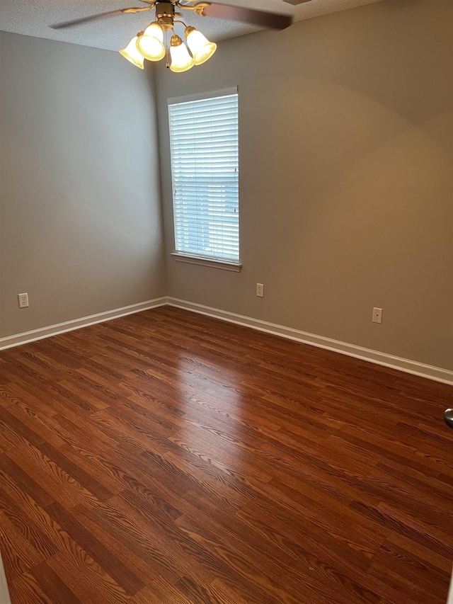 1182 Collierville-Arlington Rd, Collierville, TN 38017 - empty room with a ceiling fan and dark wood-type flooring