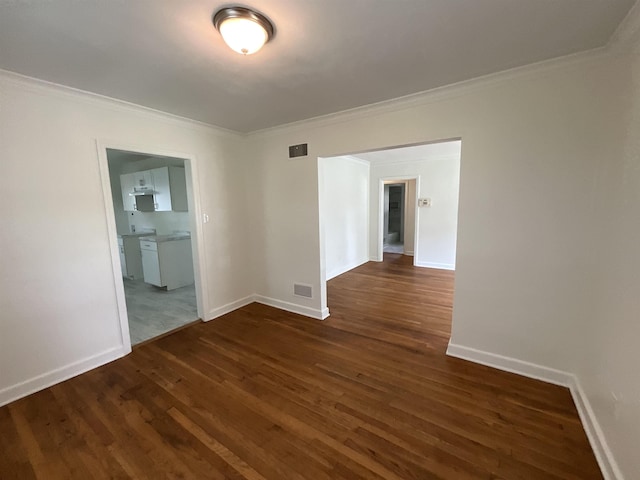1454 Railton Rd, Memphis, TN 38111 - unfurnished room with dark wood-type flooring and crown molding
