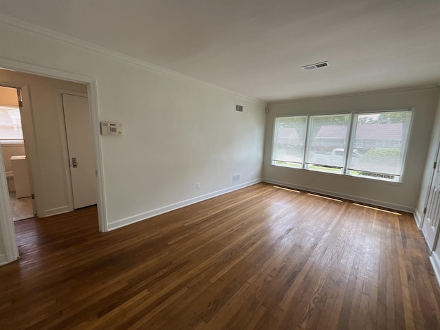 1454 Railton Rd, Memphis, TN 38111 - empty room featuring dark wood-type flooring and ornamental molding