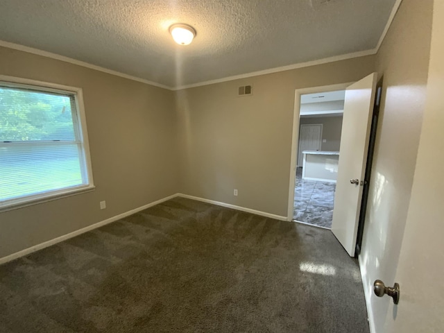 3560 Steele St, Memphis, TN 38127 - unfurnished room featuring a textured ceiling, dark carpet, and ornamental molding