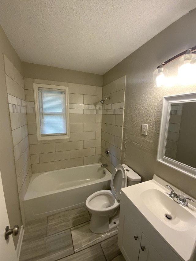 3560 Steele St, Memphis, TN 38127 - bathroom with a textured ceiling, vanity, washtub / shower combination, and a textured wall