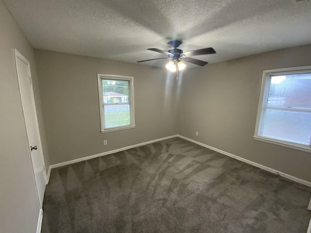 3560 Steele St, Memphis, TN 38127 - empty room with ceiling fan, dark carpet, and a textured ceiling