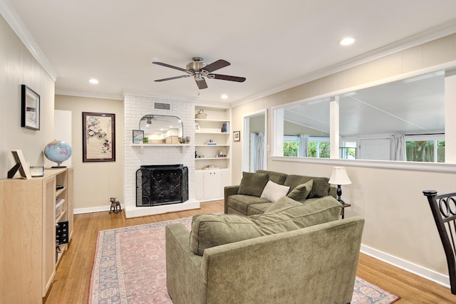 4152 Barfield Rd, Memphis, TN 38117 - living area with ornamental molding, ceiling fan, wood finished floors, a brick fireplace, and recessed lighting