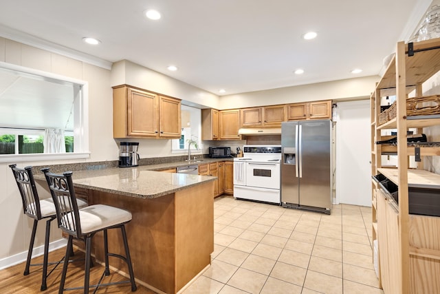 4152 Barfield Rd, Memphis, TN 38117 - kitchen with appliances with stainless steel finishes, healthy amount of natural light, a peninsula, recessed lighting, and under cabinet range hood