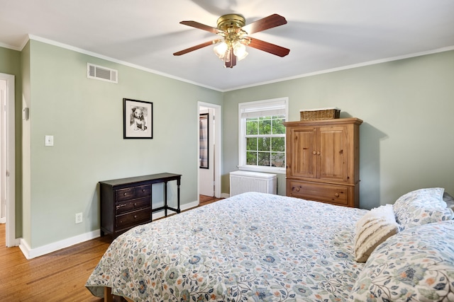 4152 Barfield Rd, Memphis, TN 38117 - bedroom with radiator, wood finished floors, ornamental molding, and ceiling fan