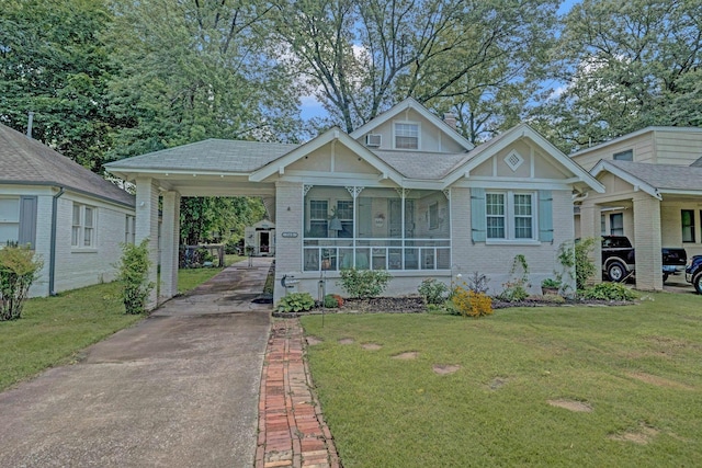 560 S Greer St, Memphis, TN 38111 - view of front of property featuring concrete driveway, a front lawn, and brick siding