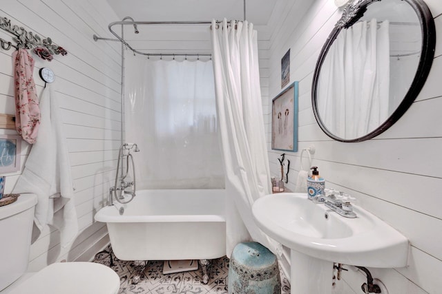 560 S Greer St, Memphis, TN 38111 - full bathroom with shower / bath combo, wooden walls, and tile patterned floors