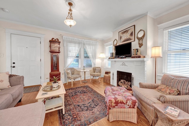 560 S Greer St, Memphis, TN 38111 - living area with crown molding, a brick fireplace, and wood finished floors