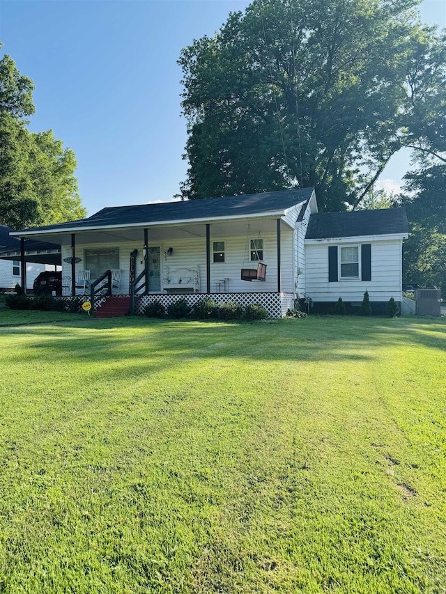 833 Hatchie St, Brownsville, TN 38012 - ranch-style house featuring covered porch, a front yard, and a carport