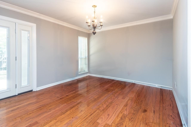 6942 Amberly Rd Unit 6942, Memphis, TN 38119 - unfurnished room with a chandelier, wood finished floors, and crown molding
