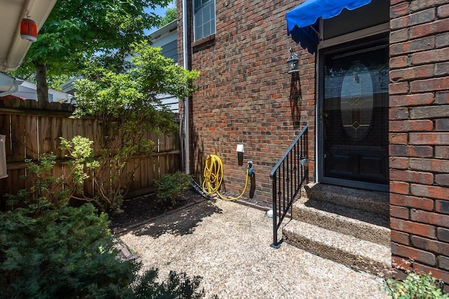 6942 Amberly Rd Unit 6942, Memphis, TN 38119 - view of exterior entry with brick siding
