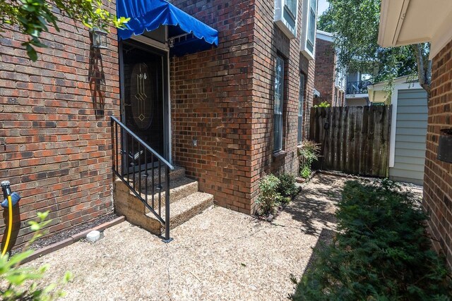 6942 Amberly Rd Unit 6942, Memphis, TN 38119 - property entrance with brick siding