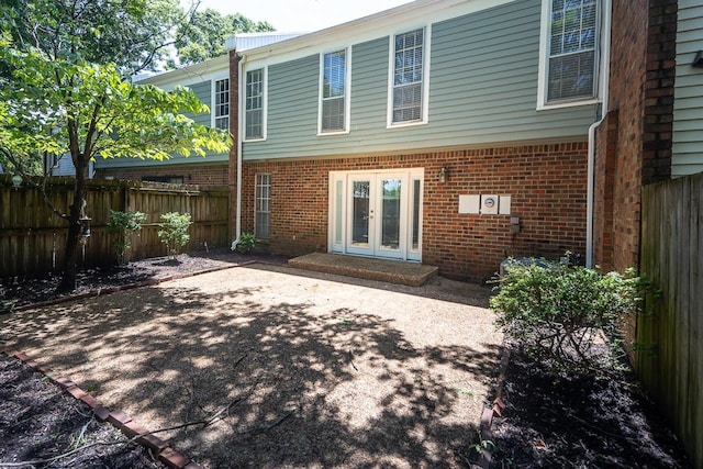 6942 Amberly Rd Unit 6942, Memphis, TN 38119 - back of house featuring french doors, a fenced backyard, brick siding, and a patio area