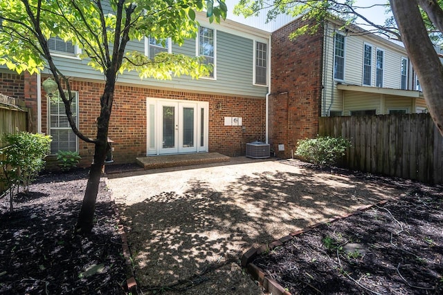 6942 Amberly Rd Unit 6942, Memphis, TN 38119 - rear view of property featuring french doors, a patio, and brick siding