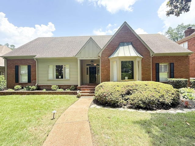 78 Pidgeon Dr, Memphis, TN 38117 - view of front of house with a front lawn, brick siding, and a shingled roof