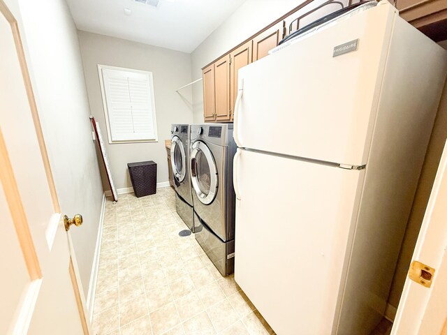 78 Pidgeon Dr, Memphis, TN 38117 - washroom with washer and dryer, light tile patterned floors, and cabinet space