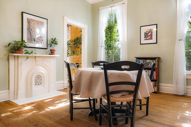 1785 Glenwood Pl, Memphis, TN 38104 - dining room with light wood-style flooring and baseboards