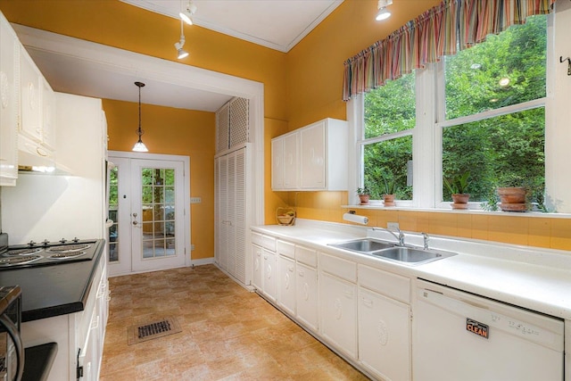 1785 Glenwood Pl, Memphis, TN 38104 - kitchen with white dishwasher, cooktop, white cabinets, hanging light fixtures, and crown molding