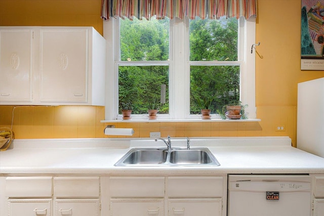 1785 Glenwood Pl, Memphis, TN 38104 - kitchen with white dishwasher, white cabinetry, light countertops, and healthy amount of natural light