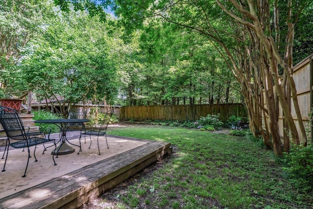 1785 Glenwood Pl, Memphis, TN 38104 - fenced backyard featuring a deck and outdoor dining area
