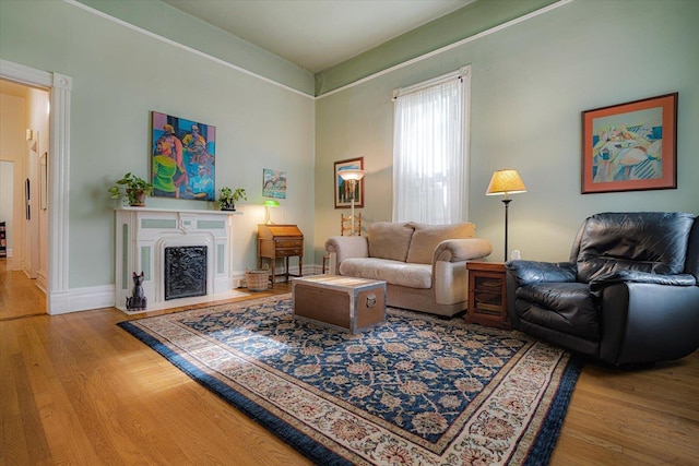 1785 Glenwood Pl, Memphis, TN 38104 - living area with wood finished floors and a fireplace with flush hearth