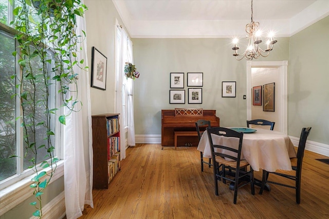 1785 Glenwood Pl, Memphis, TN 38104 - dining space featuring a chandelier and light wood-style floors