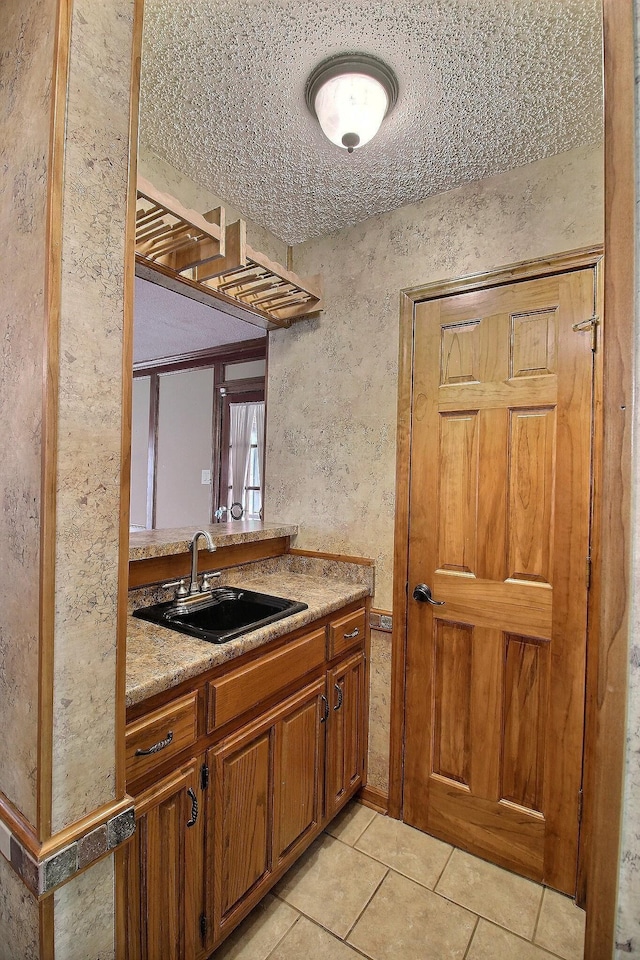 1150 Forest Wood Cv E, Collierville, TN 38017 - kitchen with light tile patterned floors, brown cabinets, and light countertops