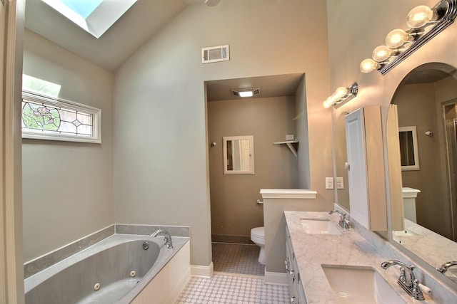 1150 Forest Wood Cv E, Collierville, TN 38017 - full bathroom featuring a tub with jets, double vanity, a skylight, and high vaulted ceiling
