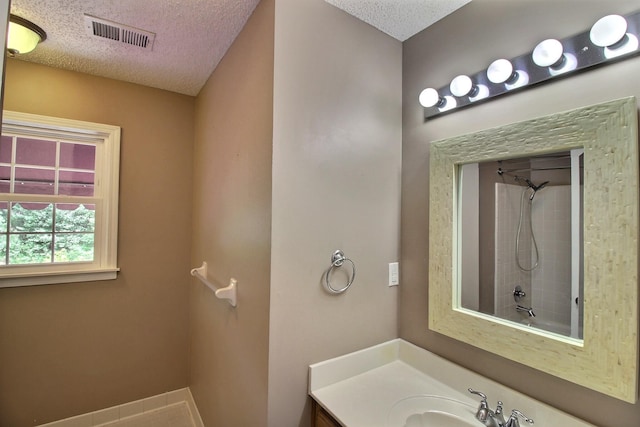 1150 Forest Wood Cv E, Collierville, TN 38017 - full bath featuring a textured ceiling, vanity, and bathtub / shower combination