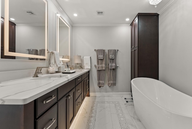 232 Windover Grove Dr, Memphis, TN 38111 - full bath featuring double vanity, recessed lighting, a freestanding bath, marble finish floors, and crown molding