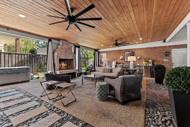 232 Windover Grove Dr, Memphis, TN 38111 - view of patio with an outdoor living space with a fireplace, ceiling fan, area for grilling, and a hot tub
