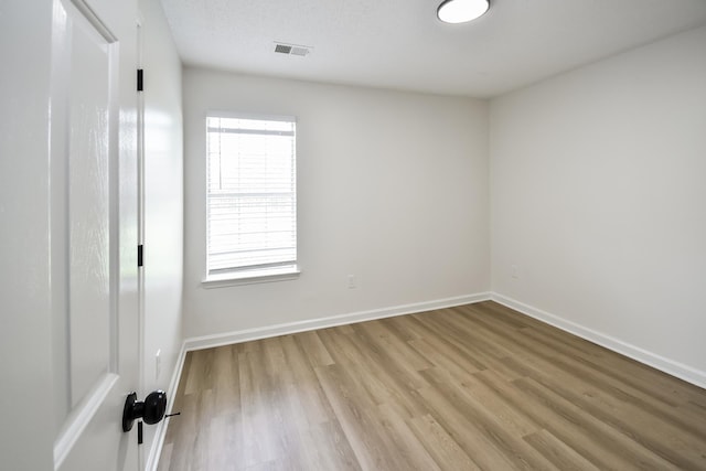 7881 Collins Wood Cv, Memphis, TN 38125 - unfurnished bedroom featuring light wood finished floors and baseboards