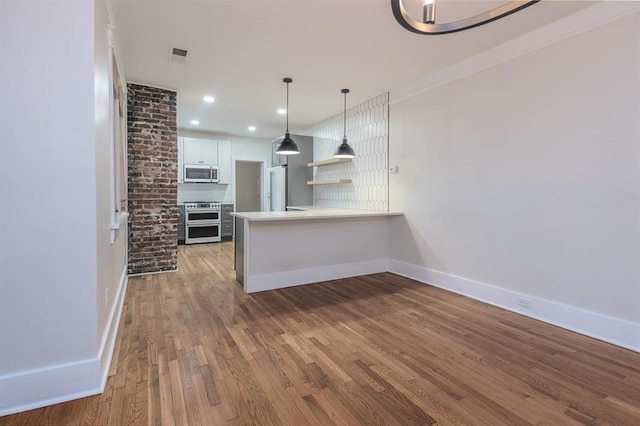 1622 Tutwiler Ave, Memphis, TN 38107 - unfurnished living room with wood finished floors, recessed lighting, and ornamental molding