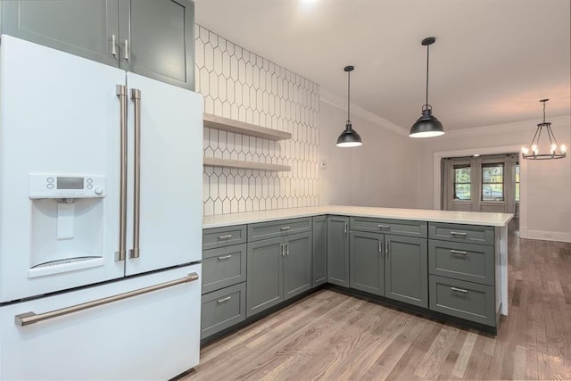 1622 Tutwiler Ave, Memphis, TN 38107 - kitchen featuring high end fridge, open shelves, light countertops, a peninsula, and ornamental molding