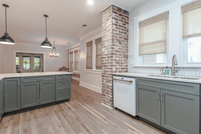 1622 Tutwiler Ave, Memphis, TN 38107 - kitchen featuring white dishwasher, gray cabinetry, light countertops, and crown molding