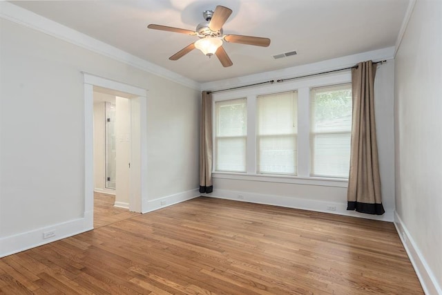 1622 Tutwiler Ave, Memphis, TN 38107 - spare room featuring a ceiling fan, light wood-style flooring, and crown molding