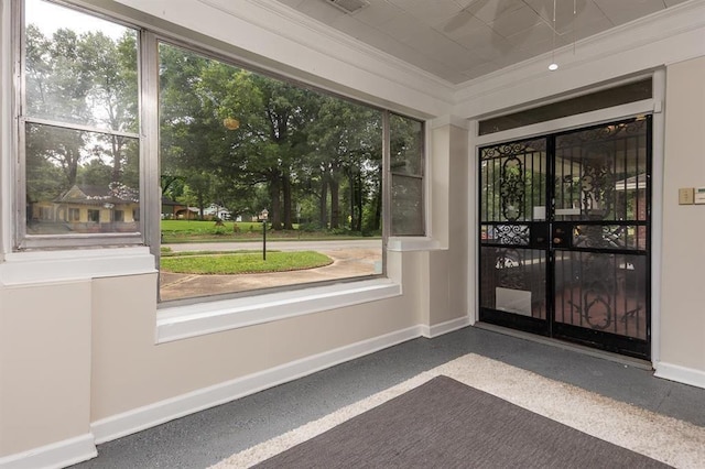 1622 Tutwiler Ave, Memphis, TN 38107 - doorway with crown molding, plenty of natural light, and speckled floor