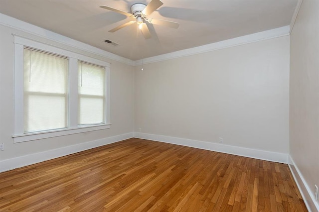 1622 Tutwiler Ave, Memphis, TN 38107 - spare room featuring light wood-type flooring, ceiling fan, and ornamental molding