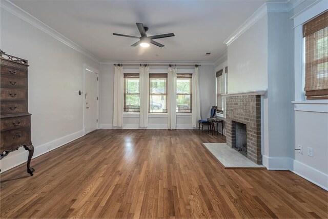 1622 Tutwiler Ave, Memphis, TN 38107 - unfurnished living room featuring ceiling fan, crown molding, wood finished floors, and a fireplace