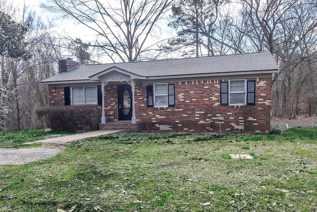 3806 Bluff Rd, Hernando, MS 38632 - ranch-style home featuring a chimney, a front lawn, brick siding, and roof with shingles