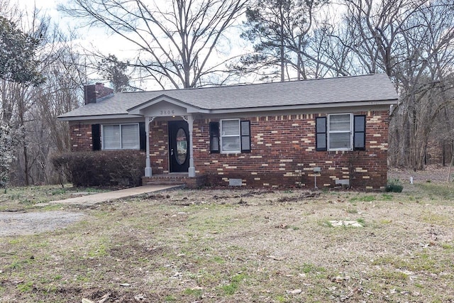 3806 Bluff Rd, Hernando, MS 38632 - ranch-style home with a chimney, brick siding, and roof with shingles
