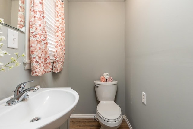3806 Bluff Rd, Hernando, MS 38632 - half bathroom with a sink and wood finished floors