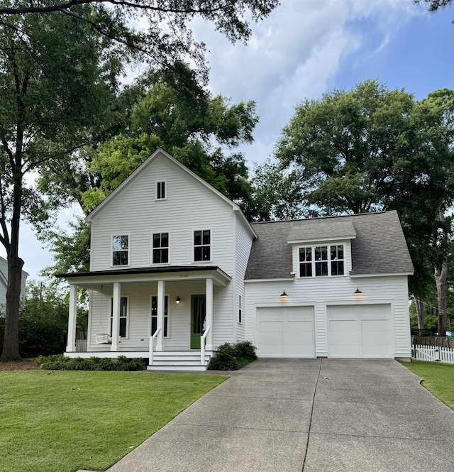 7148 Donnington Dr, Germantown, TN 38138 - view of front of property featuring driveway, covered porch, a front yard, and roof with shingles