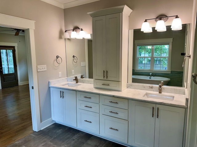 7148 Donnington Dr, Germantown, TN 38138 - full bath featuring double vanity, plenty of natural light, wood finished floors, and a tub