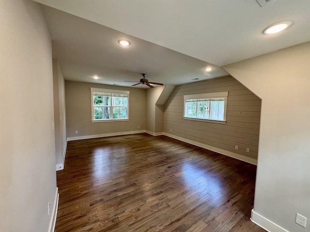 7148 Donnington Dr, Germantown, TN 38138 - additional living space with plenty of natural light, dark wood-style flooring, ceiling fan, wooden walls, and recessed lighting