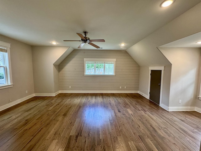 7148 Donnington Dr, Germantown, TN 38138 - bonus room featuring dark wood-type flooring, ceiling fan, lofted ceiling, wood walls, and recessed lighting